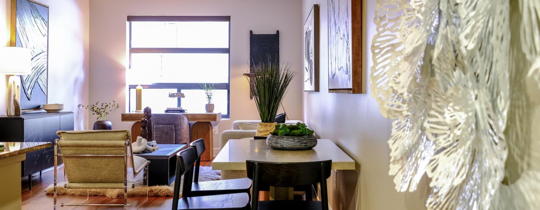 a dining room with a table and chairs