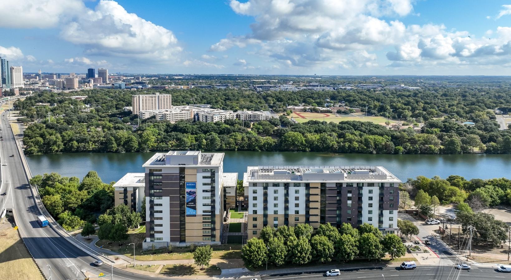 Settle into comfort at Berkshire Riverview a large building next to a body of water