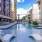 a pool with lounge chairs around it