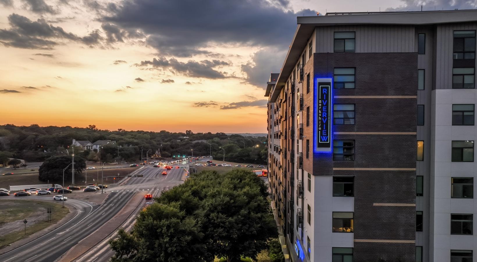 The essence of exceptional living a building with a road and trees