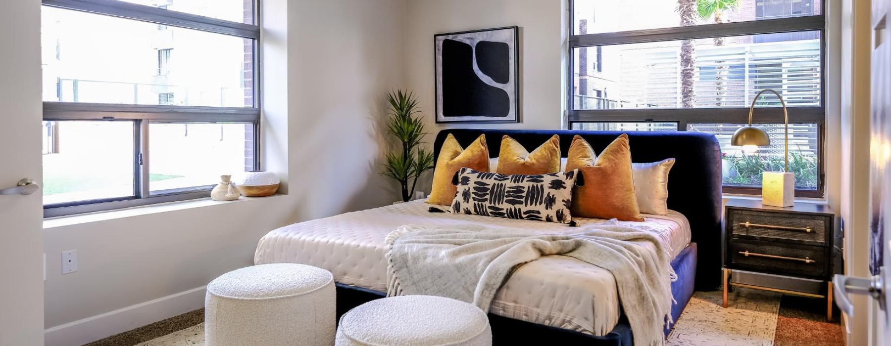 a bedroom with a large bed and a tv