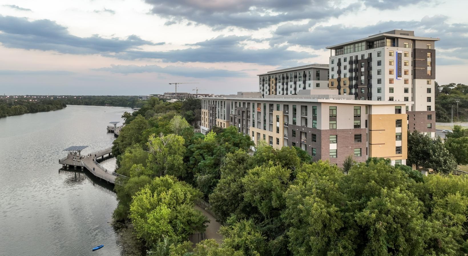 The essence of exceptional living a building next to a body of water