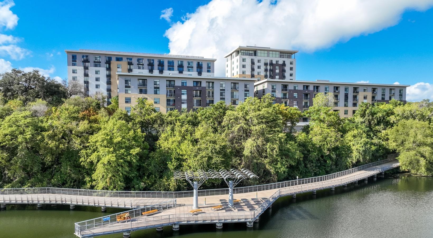 The essence of exceptional living a building with a bridge over a river