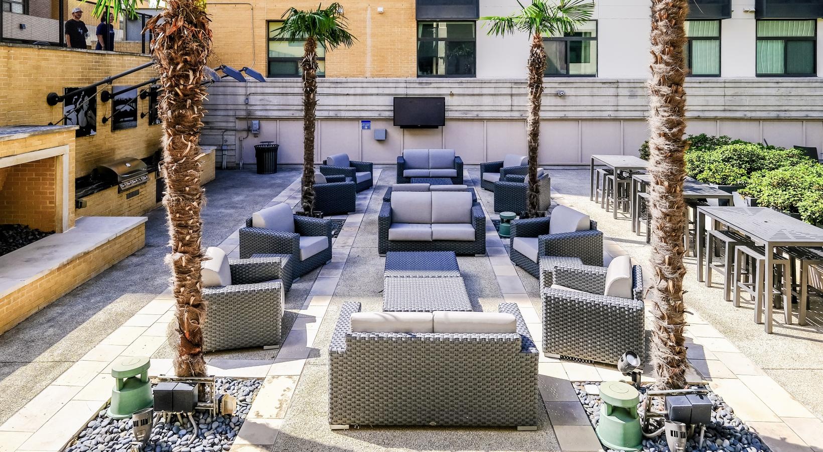 Settle into comfort at Berkshire Riverview a courtyard with chairs and trees