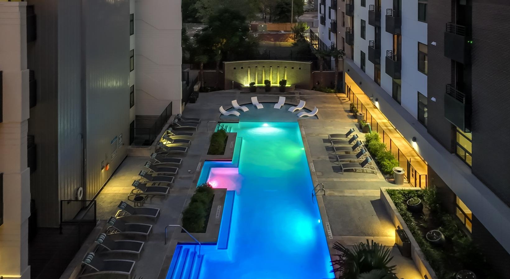 Sparkling swimming pool a pool in a courtyard between buildings