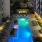 a pool in a courtyard between buildings