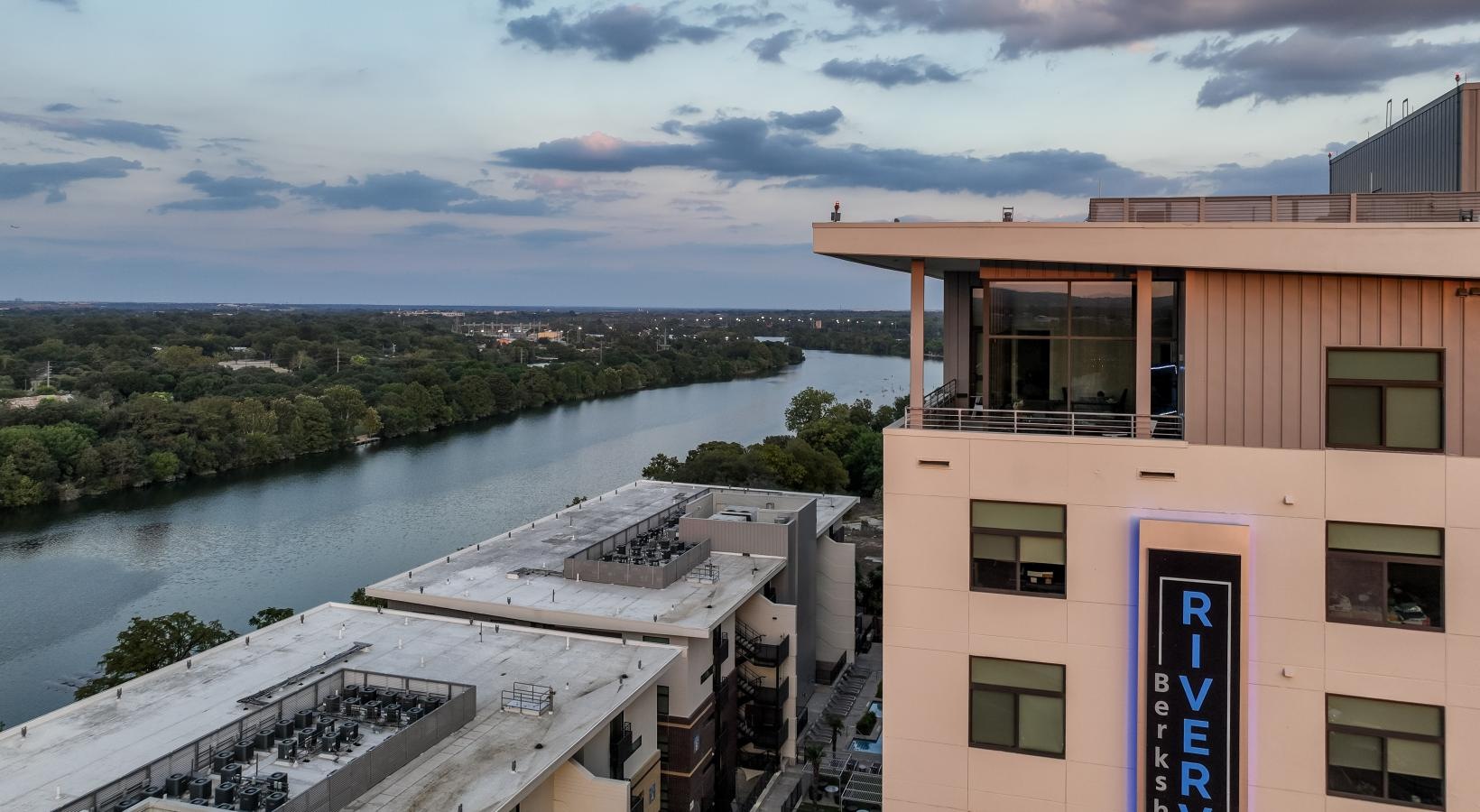The essence of exceptional living a building next to a river