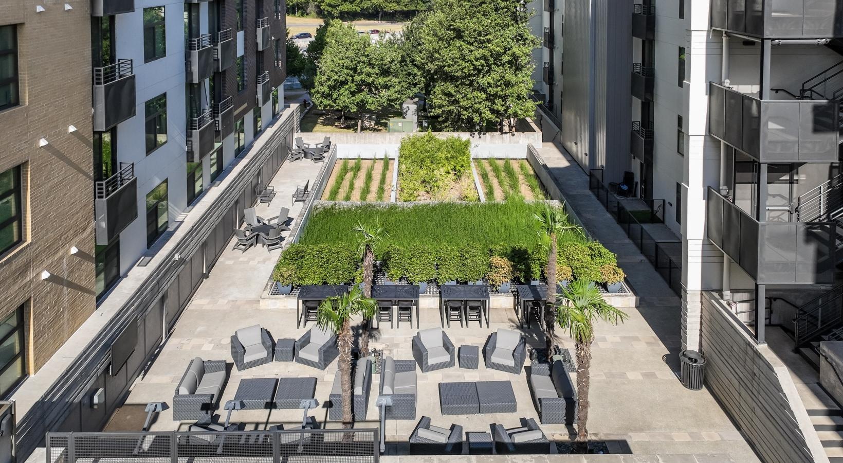 Settle into comfort at Berkshire Riverview a courtyard between buildings
