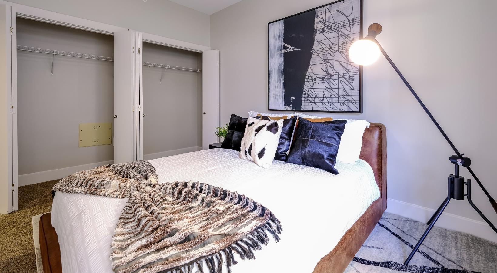 Relax and recharge in beautiful and spacious bedrooms a bed with a camera on the side